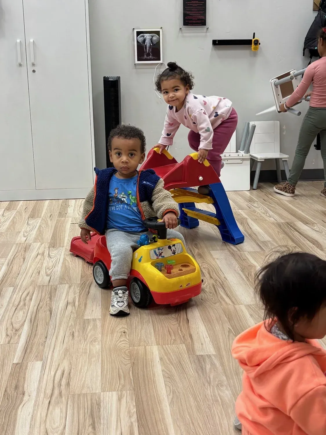 Group of children with childcare attendants at Arize Training Club